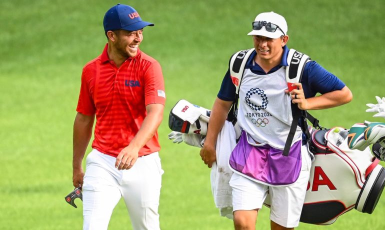 Xander Schauffele and his family gift caddie Austin Kaiser an Olympic ring